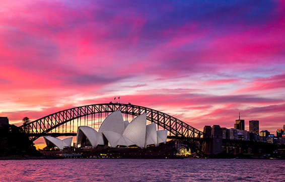 darling harbour and sydney opera house pink sunset